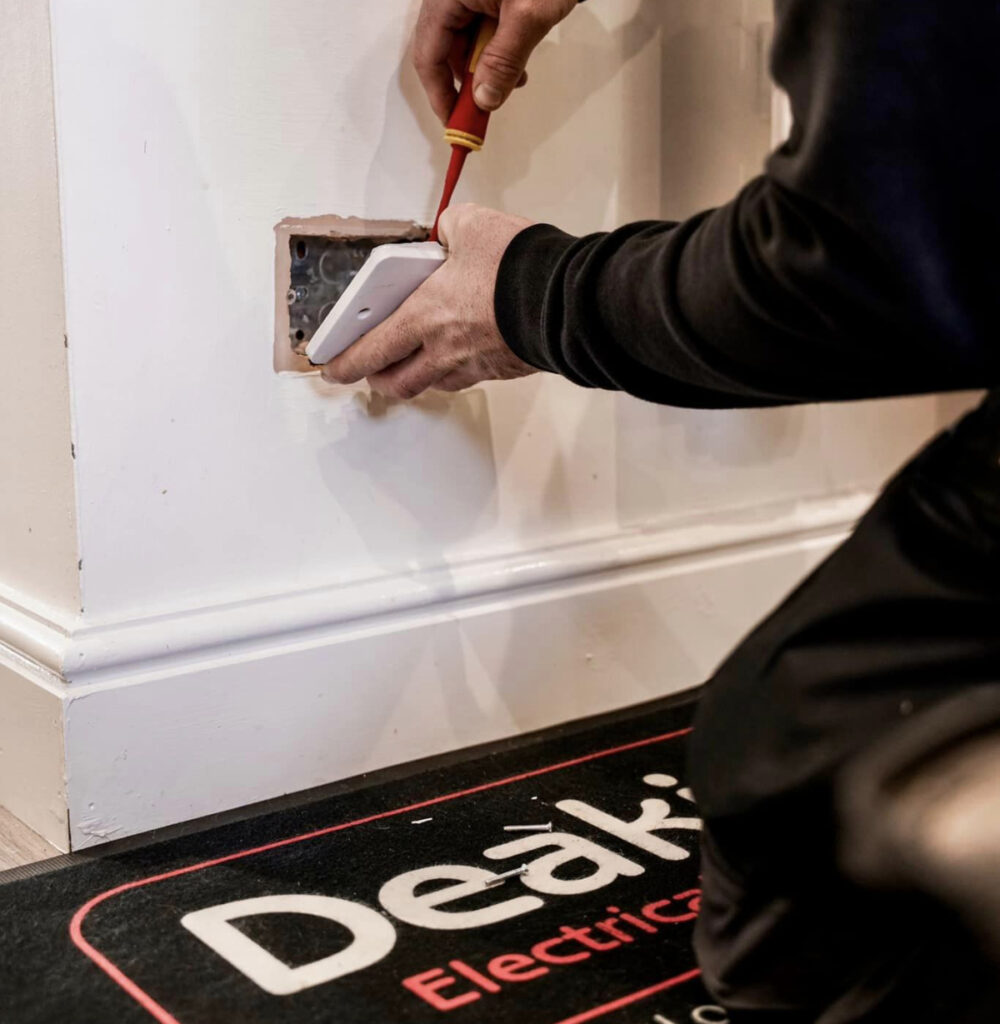 Deakin's electrician fitting an electrical socket